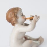 Delicate set of four hand-painted porcelain putti musicians crafted by the Höchst manufactory in Germany, circa 1767–1779. Each figure depicts a different musical instrument and bears the distinctive Höchst wheel mark with radiating spokes. Approx. 1.77 × 1.77 × 1.18 in. A fine example of late Rococo artistry.