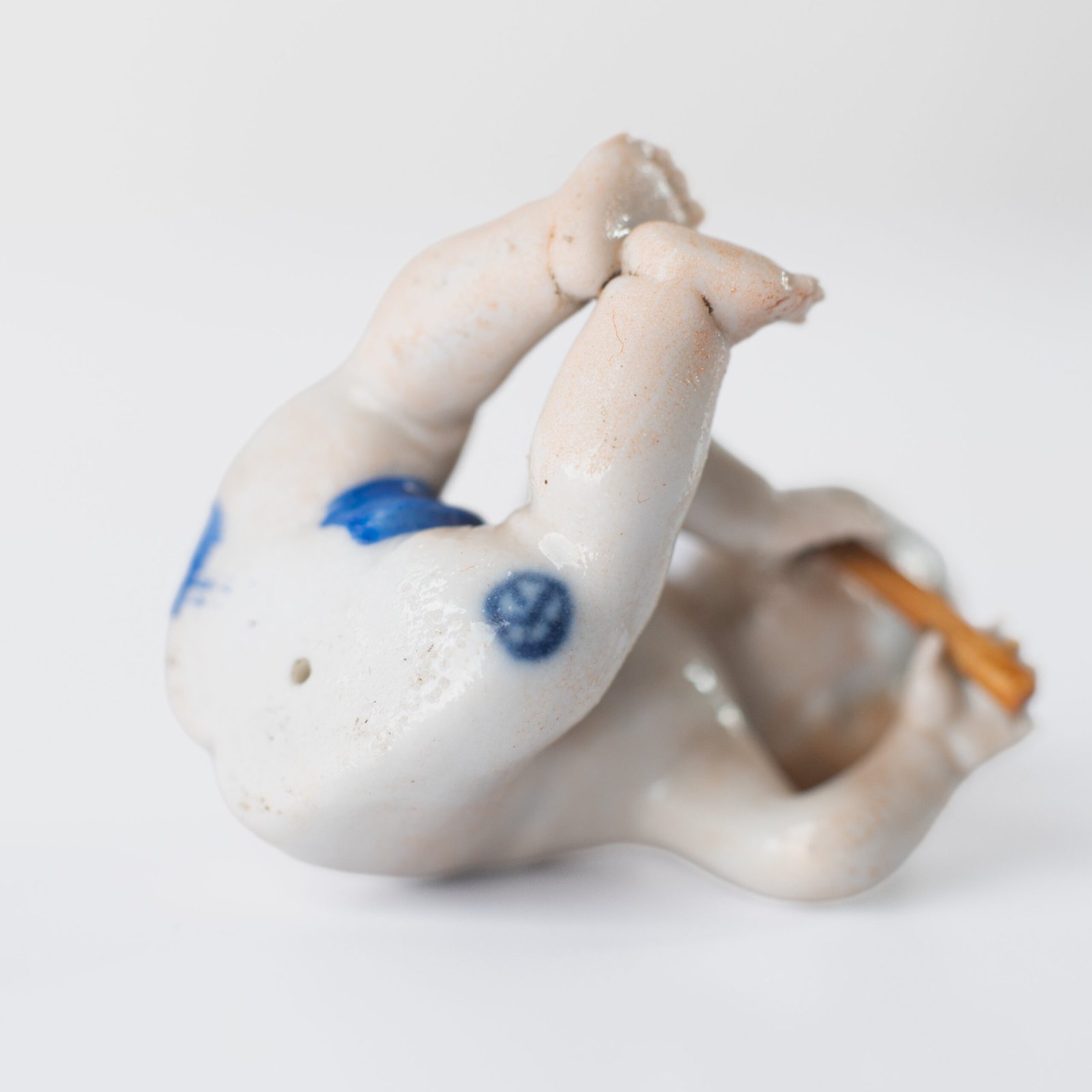 Delicate set of four hand-painted porcelain putti musicians crafted by the Höchst manufactory in Germany, circa 1767–1779. Each figure depicts a different musical instrument and bears the distinctive Höchst wheel mark with radiating spokes. Approx. 1.77 × 1.77 × 1.18 in. A fine example of late Rococo artistry.