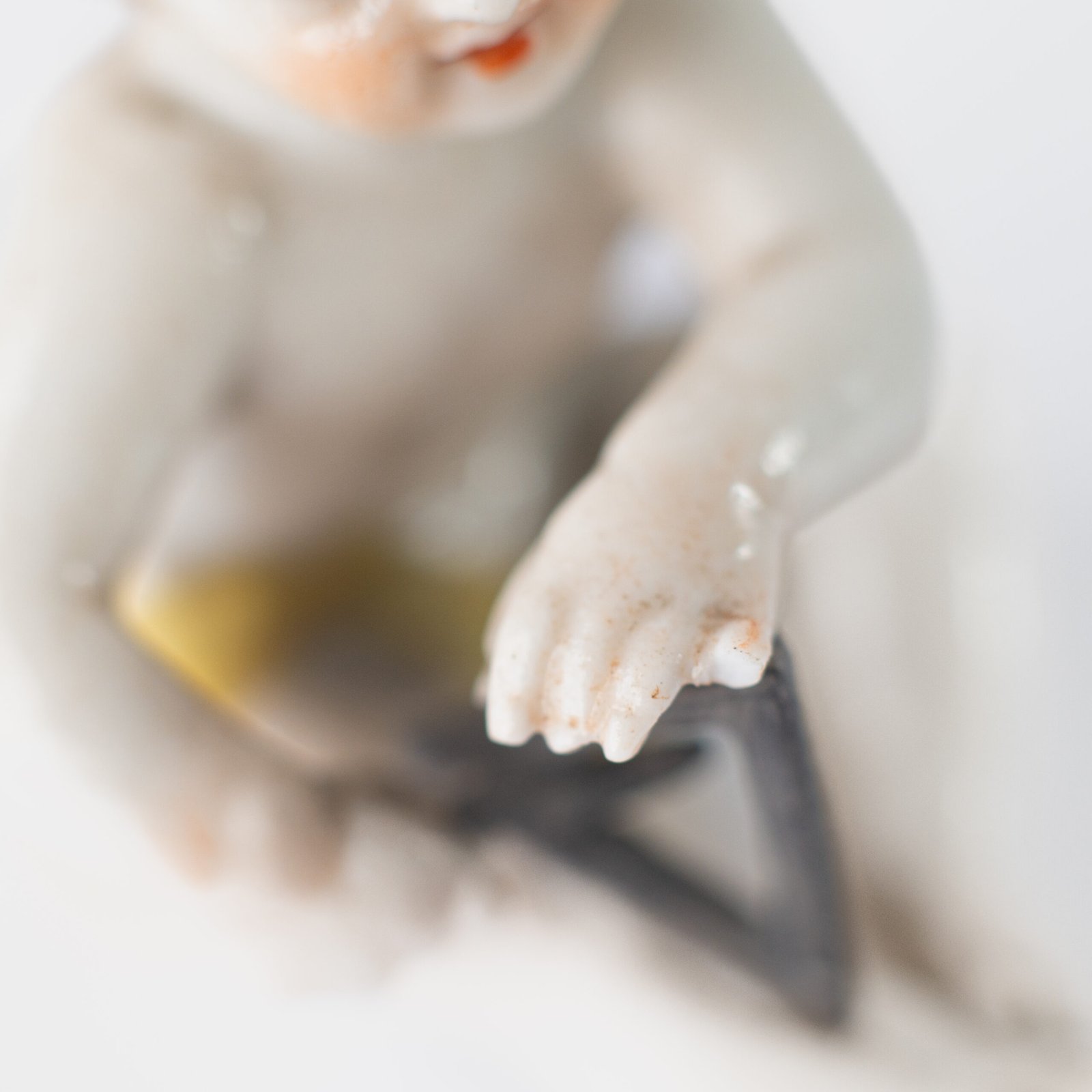 Delicate set of four hand-painted porcelain putti musicians crafted by the Höchst manufactory in Germany, circa 1767–1779. Each figure depicts a different musical instrument and bears the distinctive Höchst wheel mark with radiating spokes. Approx. 1.77 × 1.77 × 1.18 in. A fine example of late Rococo artistry.