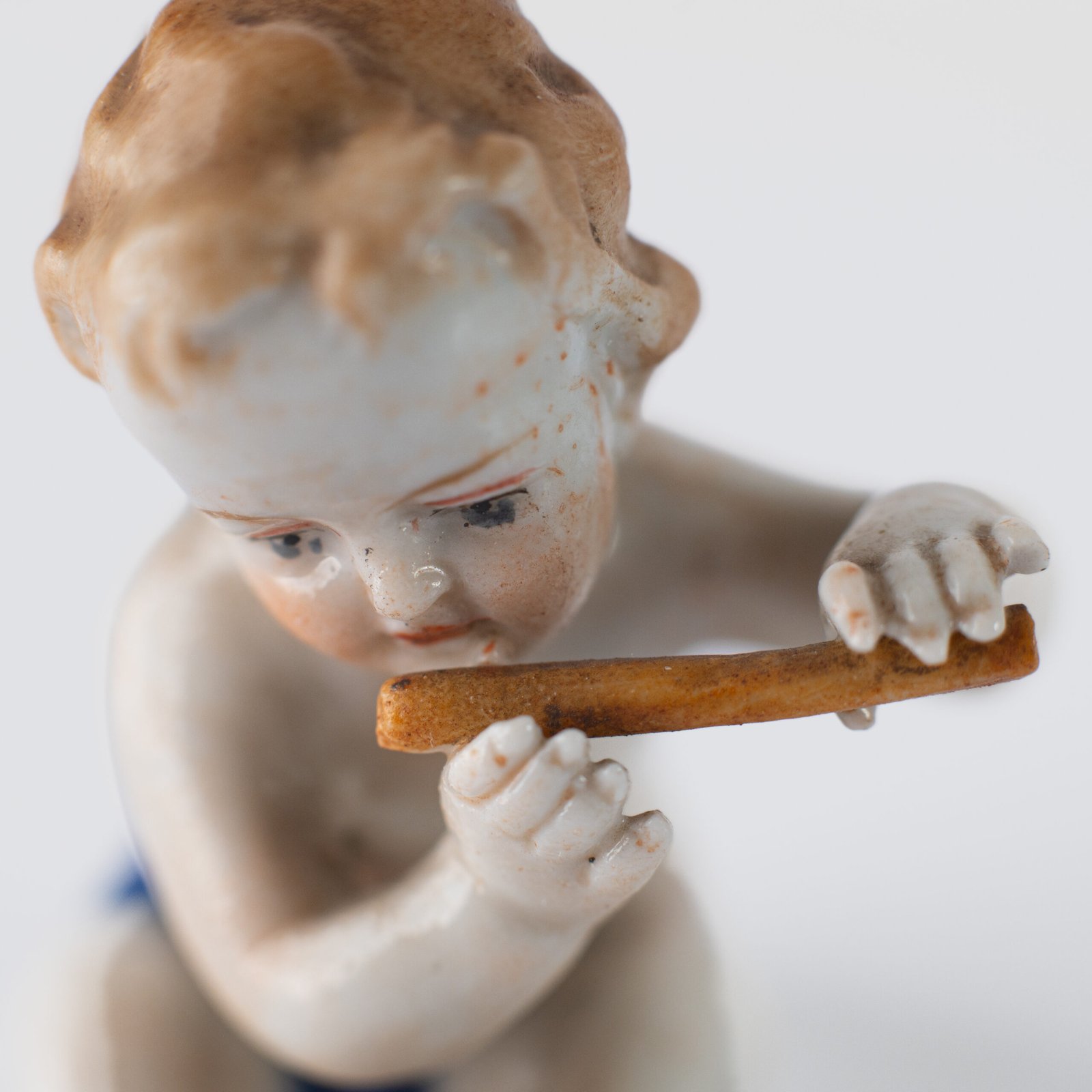 Delicate set of four hand-painted porcelain putti musicians crafted by the Höchst manufactory in Germany, circa 1767–1779. Each figure depicts a different musical instrument and bears the distinctive Höchst wheel mark with radiating spokes. Approx. 1.77 × 1.77 × 1.18 in. A fine example of late Rococo artistry.