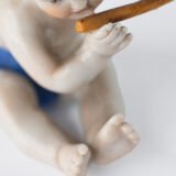 Delicate set of four hand-painted porcelain putti musicians crafted by the Höchst manufactory in Germany, circa 1767–1779. Each figure depicts a different musical instrument and bears the distinctive Höchst wheel mark with radiating spokes. Approx. 1.77 × 1.77 × 1.18 in. A fine example of late Rococo artistry.