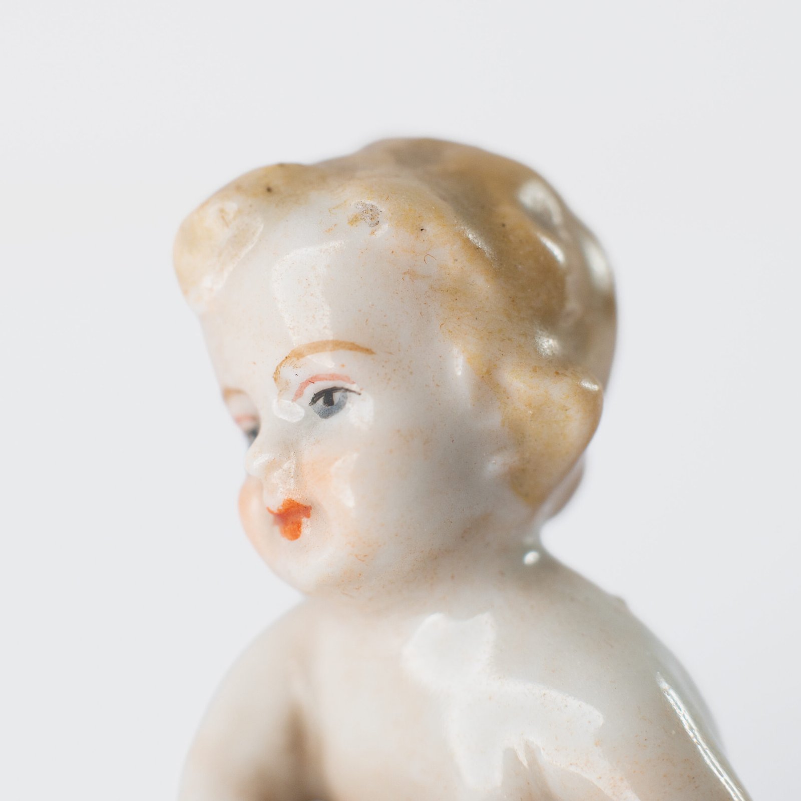 Delicate set of four hand-painted porcelain putti musicians crafted by the Höchst manufactory in Germany, circa 1767–1779. Each figure depicts a different musical instrument and bears the distinctive Höchst wheel mark with radiating spokes. Approx. 1.77 × 1.77 × 1.18 in. A fine example of late Rococo artistry.