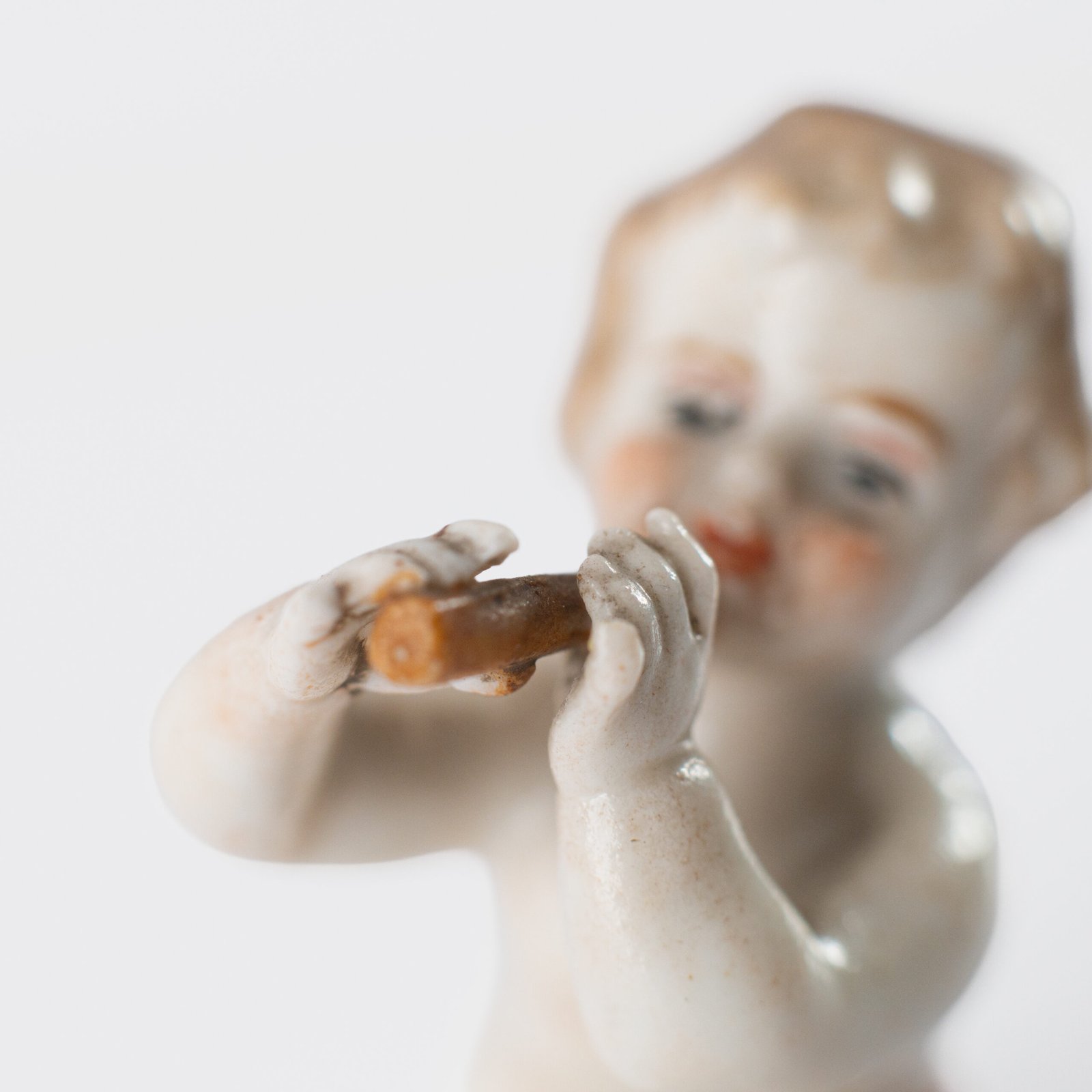 Delicate set of four hand-painted porcelain putti musicians crafted by the Höchst manufactory in Germany, circa 1767–1779. Each figure depicts a different musical instrument and bears the distinctive Höchst wheel mark with radiating spokes. Approx. 1.77 × 1.77 × 1.18 in. A fine example of late Rococo artistry.