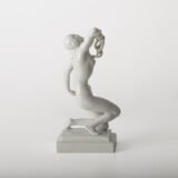 Art Deco porcelain sculpture of Cleopatra kneeling with a snake, in white glazed porcelain by Herend, signed in relief by sculptor Szigethy Nagy István, circa 1930.