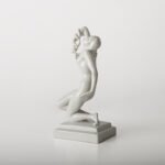 Art Deco porcelain sculpture of Cleopatra kneeling with a snake, in white glazed porcelain by Herend, signed in relief by sculptor Szigethy Nagy István, circa 1930.