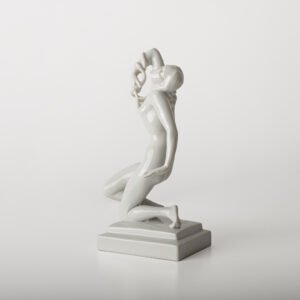 Art Deco porcelain sculpture of Cleopatra kneeling with a snake, in white glazed porcelain by Herend, signed in relief by sculptor Szigethy Nagy István, circa 1930.