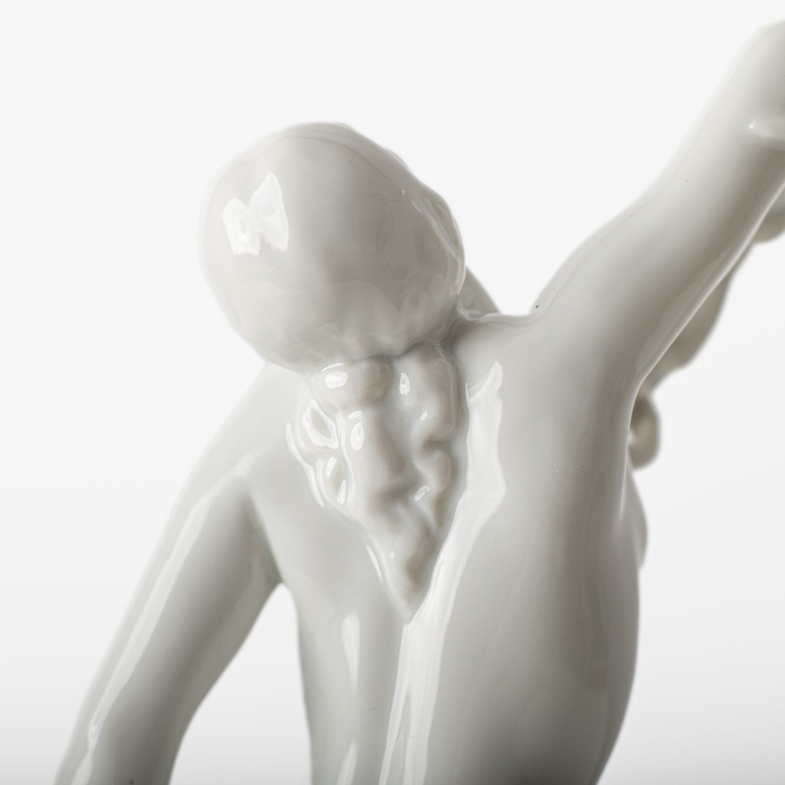 Art Deco porcelain sculpture of Cleopatra kneeling with a snake, in white glazed porcelain by Herend, signed in relief by sculptor Szigethy Nagy István, circa 1930.