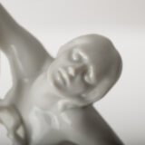 Art Deco porcelain sculpture of Cleopatra kneeling with a snake, in white glazed porcelain by Herend, signed in relief by sculptor Szigethy Nagy István, circa 1930.