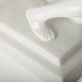Art Deco porcelain sculpture of Cleopatra kneeling with a snake, in white glazed porcelain by Herend, signed in relief by sculptor Szigethy Nagy István, circa 1930.