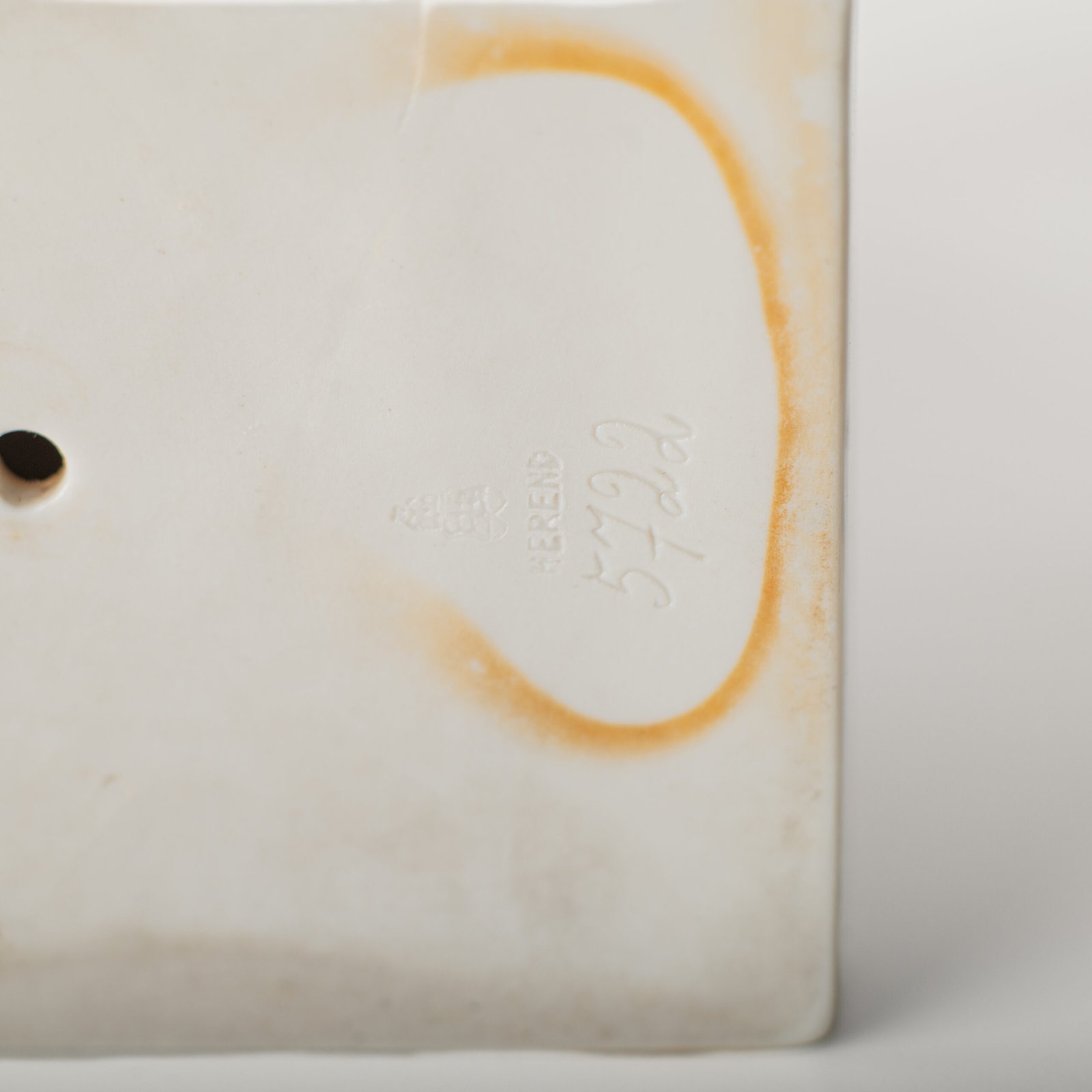 Art Deco porcelain sculpture of Cleopatra kneeling with a snake, in white glazed porcelain by Herend, signed in relief by sculptor Szigethy Nagy István, circa 1930.