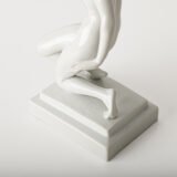 Art Deco porcelain sculpture of Cleopatra kneeling with a snake, in white glazed porcelain by Herend, signed in relief by sculptor Szigethy Nagy István, circa 1930.