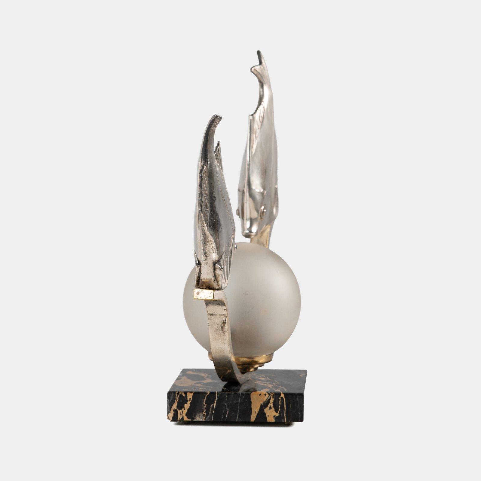 Original French Art Deco table lamp ca. 1930, signed by M. Font on both silvered metal fish figures, with sculptural design, frosted glass globe, and black Portoro marble base with natural golden veining. Measures 12.2 in high, 13.4 in wide, and 4.3 in deep.