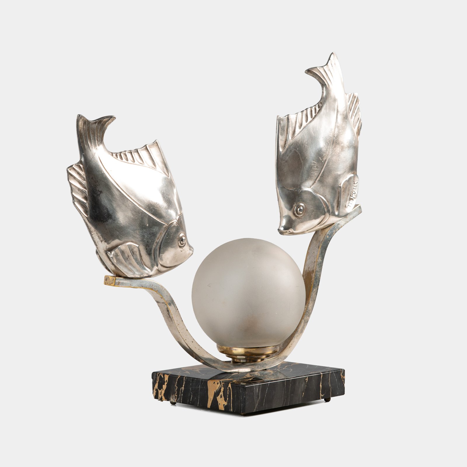 Original French Art Deco table lamp ca. 1930, signed by M. Font on both silvered metal fish figures, with sculptural design, frosted glass globe, and black Portoro marble base with natural golden veining. Measures 12.2 in high, 13.4 in wide, and 4.3 in deep.