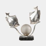 Original French Art Deco table lamp ca. 1930, signed by M. Font on both silvered metal fish figures, with sculptural design, frosted glass globe, and black Portoro marble base with natural golden veining. Measures 12.2 in high, 13.4 in wide, and 4.3 in deep.