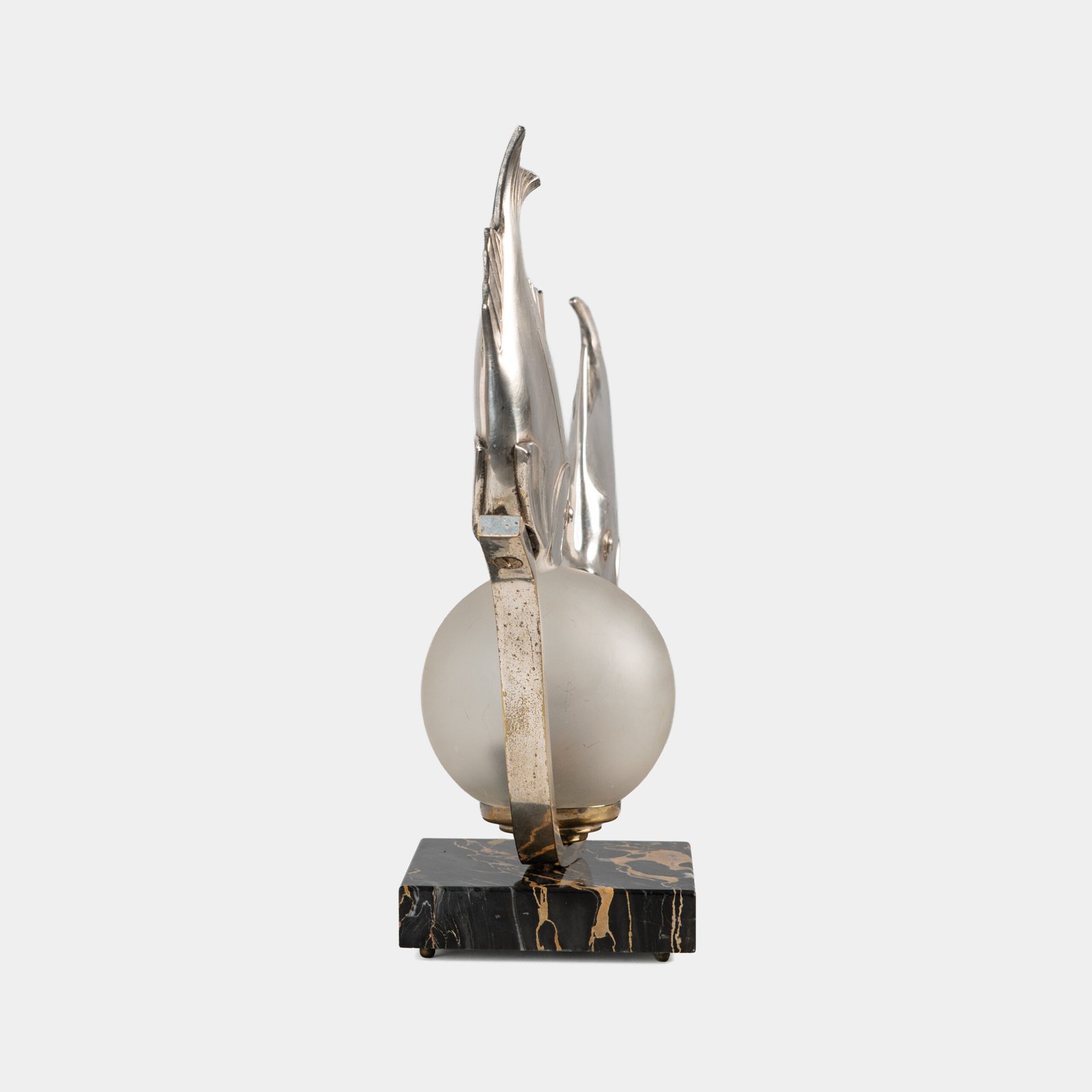 Original French Art Deco table lamp ca. 1930, signed by M. Font on both silvered metal fish figures, with sculptural design, frosted glass globe, and black Portoro marble base with natural golden veining. Measures 12.2 in high, 13.4 in wide, and 4.3 in deep.