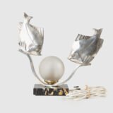 Original French Art Deco table lamp ca. 1930, signed by M. Font on both silvered metal fish figures, with sculptural design, frosted glass globe, and black Portoro marble base with natural golden veining. Measures 12.2 in high, 13.4 in wide, and 4.3 in deep.
