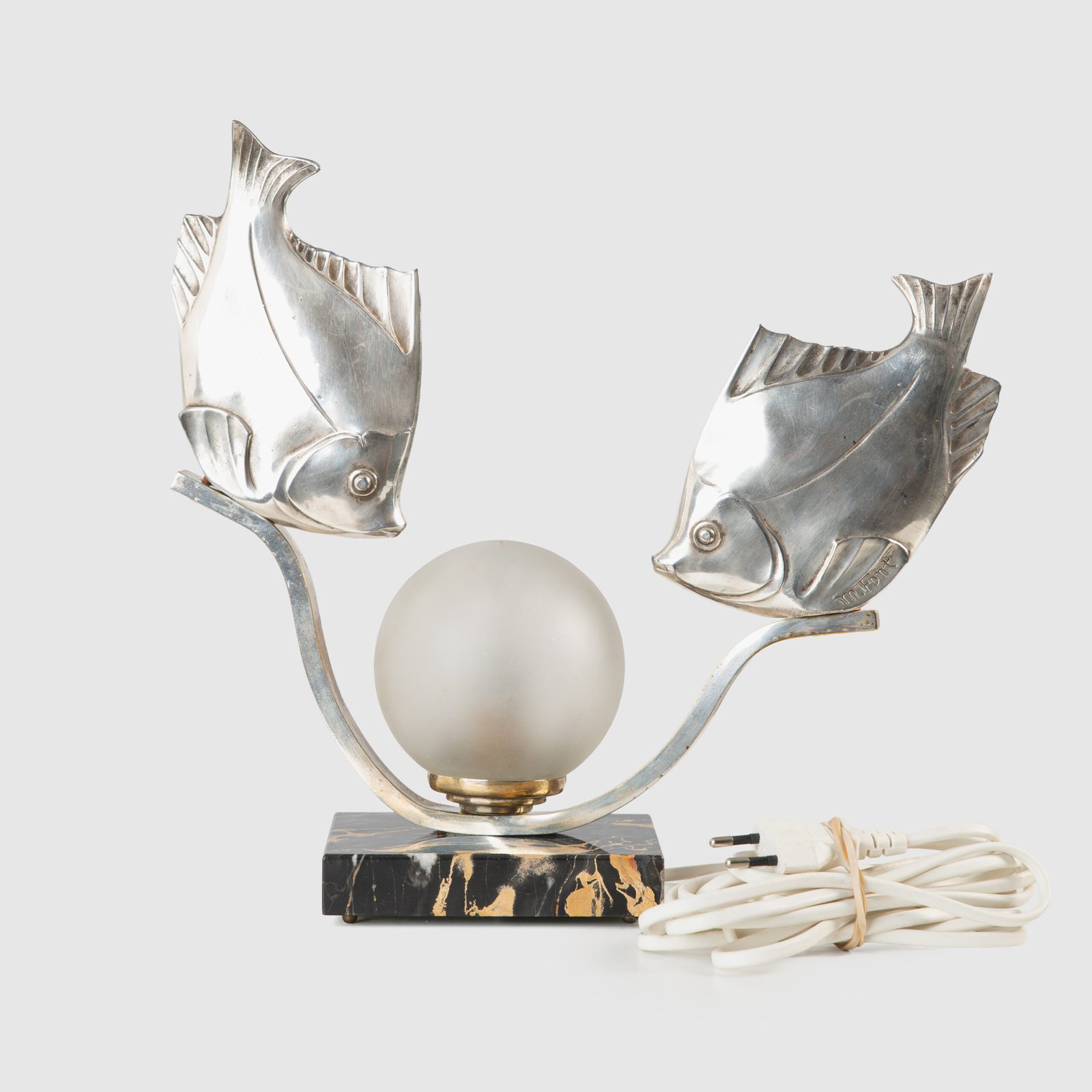 Original French Art Deco table lamp ca. 1930, signed by M. Font on both silvered metal fish figures, with sculptural design, frosted glass globe, and black Portoro marble base with natural golden veining. Measures 12.2 in high, 13.4 in wide, and 4.3 in deep.