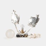 Original French Art Deco table lamp ca. 1930, signed by M. Font on both silvered metal fish figures, with sculptural design, frosted glass globe, and black Portoro marble base with natural golden veining. Measures 12.2 in high, 13.4 in wide, and 4.3 in deep.
