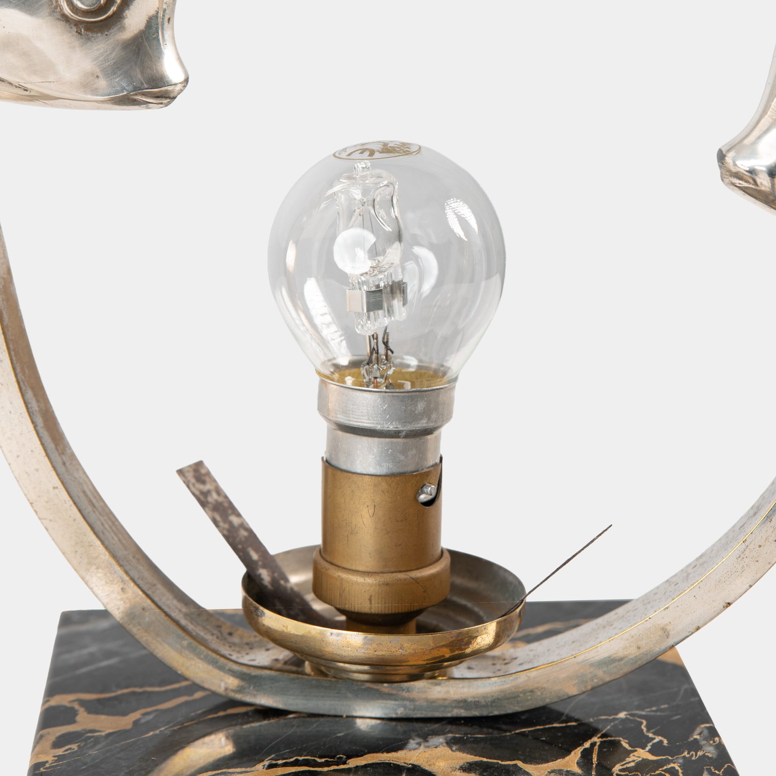 Original French Art Deco table lamp ca. 1930, signed by M. Font on both silvered metal fish figures, with sculptural design, frosted glass globe, and black Portoro marble base with natural golden veining. Measures 12.2 in high, 13.4 in wide, and 4.3 in deep.