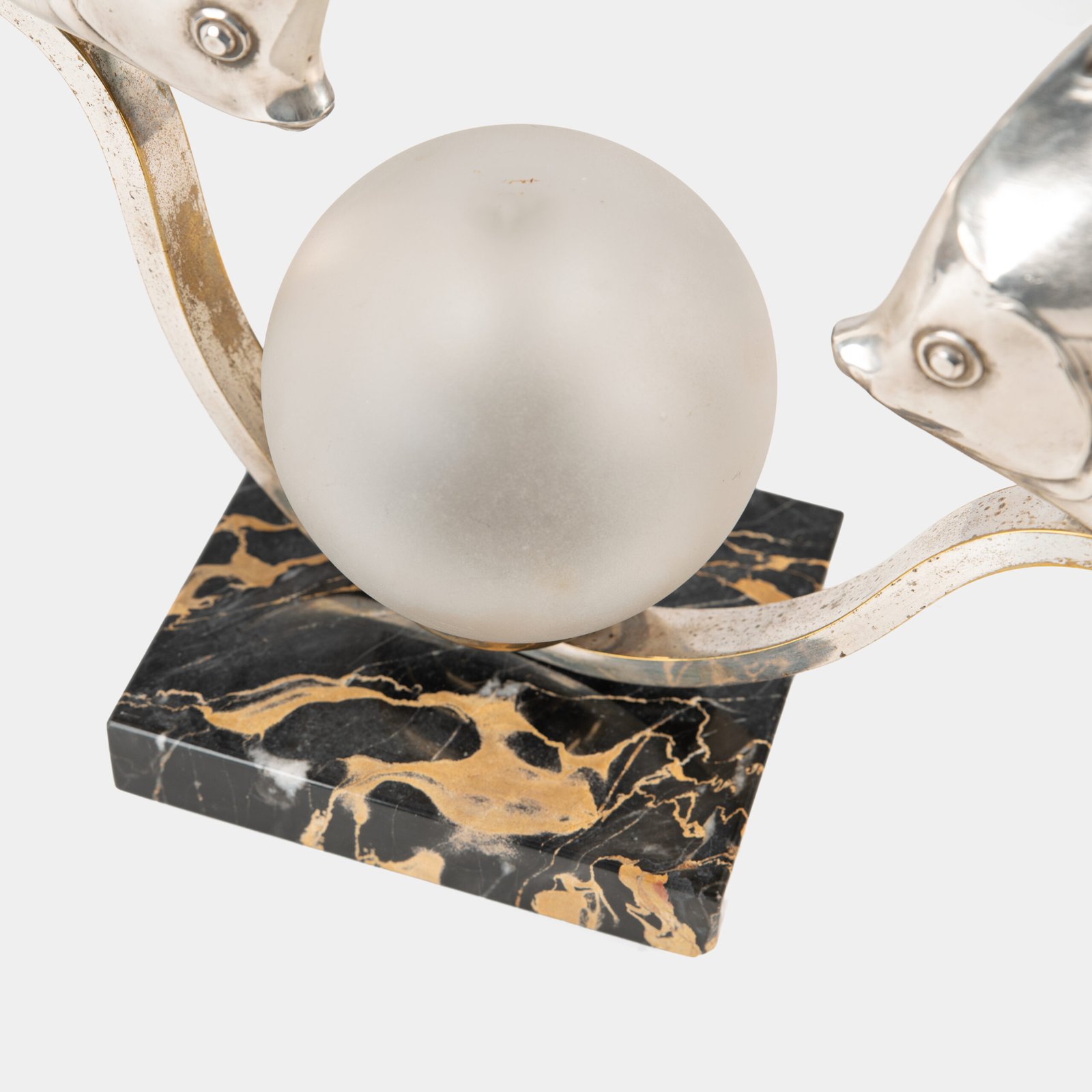 Original French Art Deco table lamp ca. 1930, signed by M. Font on both silvered metal fish figures, with sculptural design, frosted glass globe, and black Portoro marble base with natural golden veining. Measures 12.2 in high, 13.4 in wide, and 4.3 in deep.