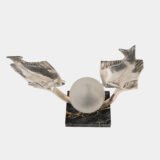 Original French Art Deco table lamp ca. 1930, signed by M. Font on both silvered metal fish figures, with sculptural design, frosted glass globe, and black Portoro marble base with natural golden veining. Measures 12.2 in high, 13.4 in wide, and 4.3 in deep.