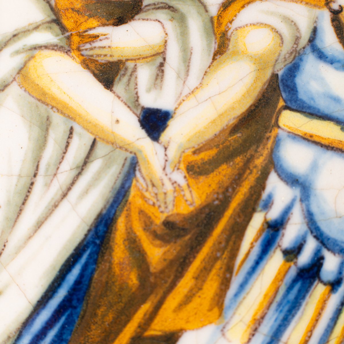 Hand-painted Italian maiolica plate, Deruta or Urbino, late 17th to early 18th century. Depicts Mercury with winged sandals beside a female figure, likely an allegory of Peace, Concord, or Wisdom. Rich Baroque border with cherubs, musical instruments, and cartouches. Tin-glazed earthenware with visible craquelure and minor rim losses.