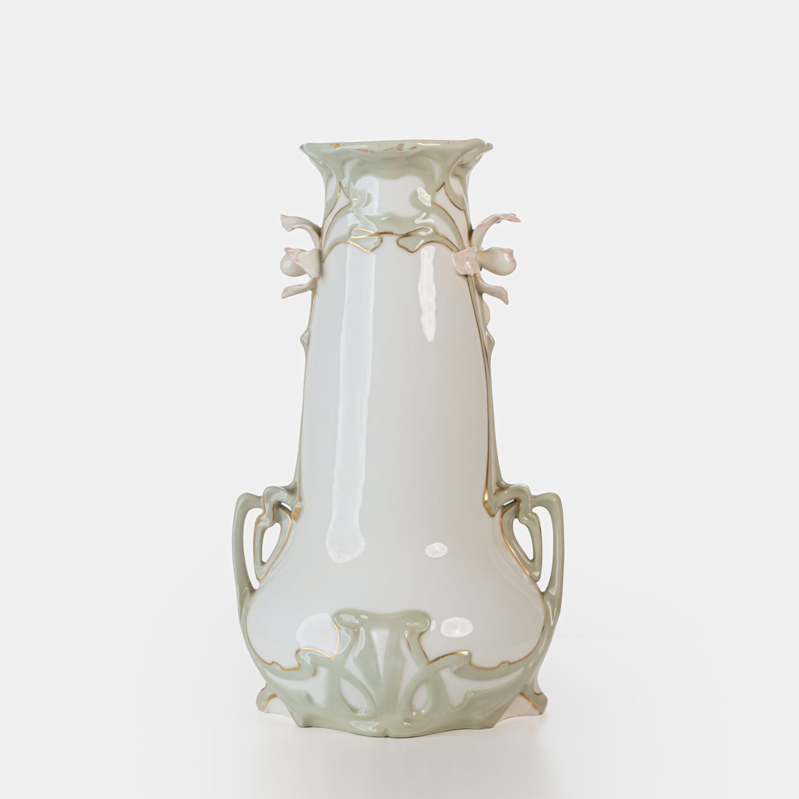 Art Nouveau porcelain vase by Karl Ens, circa 1900, featuring a sculptural composition in high relief with a maiden and cherub, hand-painted with floral details and highlighted with gilding. Marked “KVE” on the base.