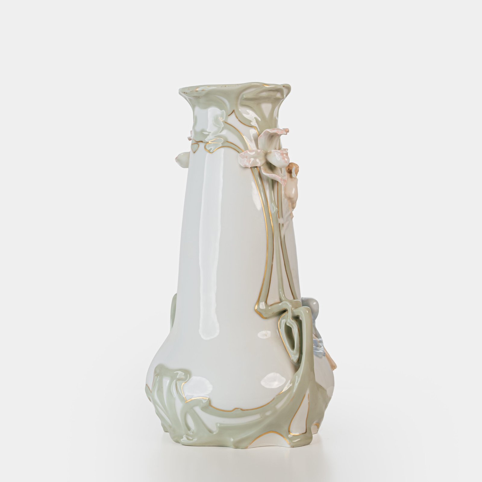 Art Nouveau porcelain vase by Karl Ens, circa 1900, featuring a sculptural composition in high relief with a maiden and cherub, hand-painted with floral details and highlighted with gilding. Marked “KVE” on the base.