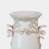 Art Nouveau porcelain vase by Karl Ens, circa 1900, featuring a sculptural composition in high relief with a maiden and cherub, hand-painted with floral details and highlighted with gilding. Marked “KVE” on the base.