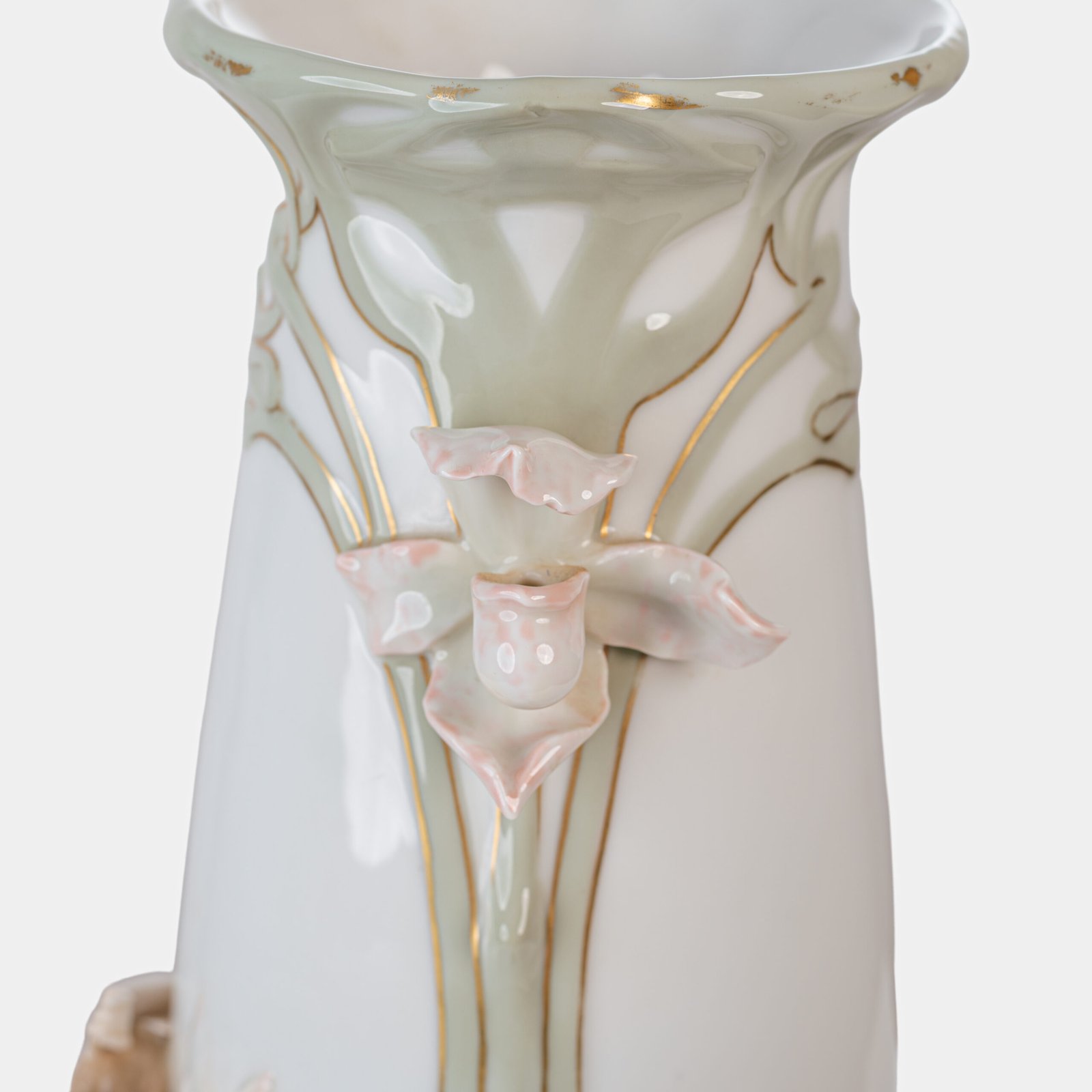 Art Nouveau porcelain vase by Karl Ens, circa 1900, featuring a sculptural composition in high relief with a maiden and cherub, hand-painted with floral details and highlighted with gilding. Marked “KVE” on the base.