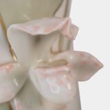 Art Nouveau porcelain vase by Karl Ens, circa 1900, featuring a sculptural composition in high relief with a maiden and cherub, hand-painted with floral details and highlighted with gilding. Marked “KVE” on the base.