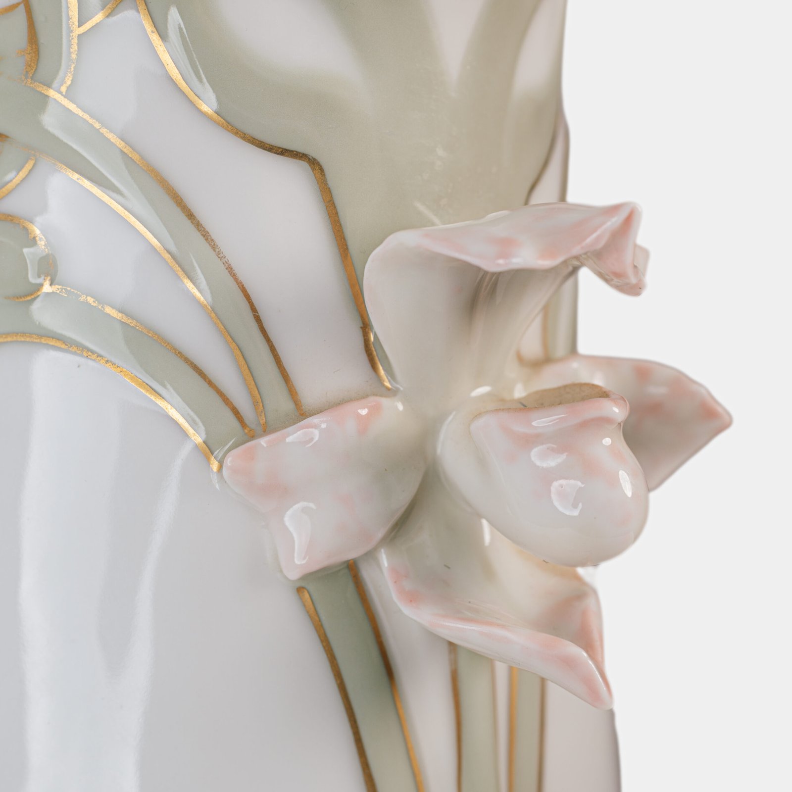 Art Nouveau porcelain vase by Karl Ens, circa 1900, featuring a sculptural composition in high relief with a maiden and cherub, hand-painted with floral details and highlighted with gilding. Marked “KVE” on the base.