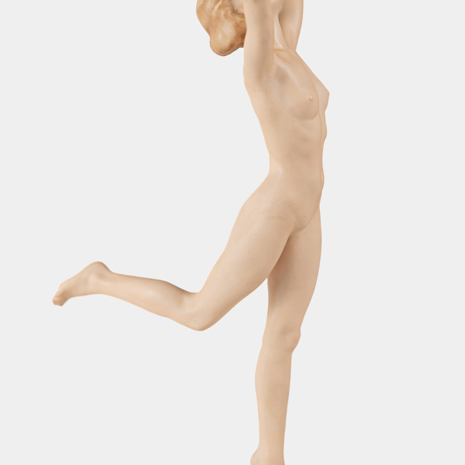 Karl Tutter porcelain figurine “Sonnenkind” – Art Deco sculpture by Hutschenreuther Germany, c.1935–1940 Art Deco porcelain figurine titled “Sonnenkind” (“Sun Child”), modeled by Karl Tutter for Hutschenreuther ca. 1935–1940. Depicts a nude young woman balancing on a golden sphere, arms extended in a dynamic pose. White porcelain with a matte pinkish flesh-tone finish, painted facial features, and satin brown hair. Gilded accents on the sphere and base. Rare signed version with circular base and gold trim.