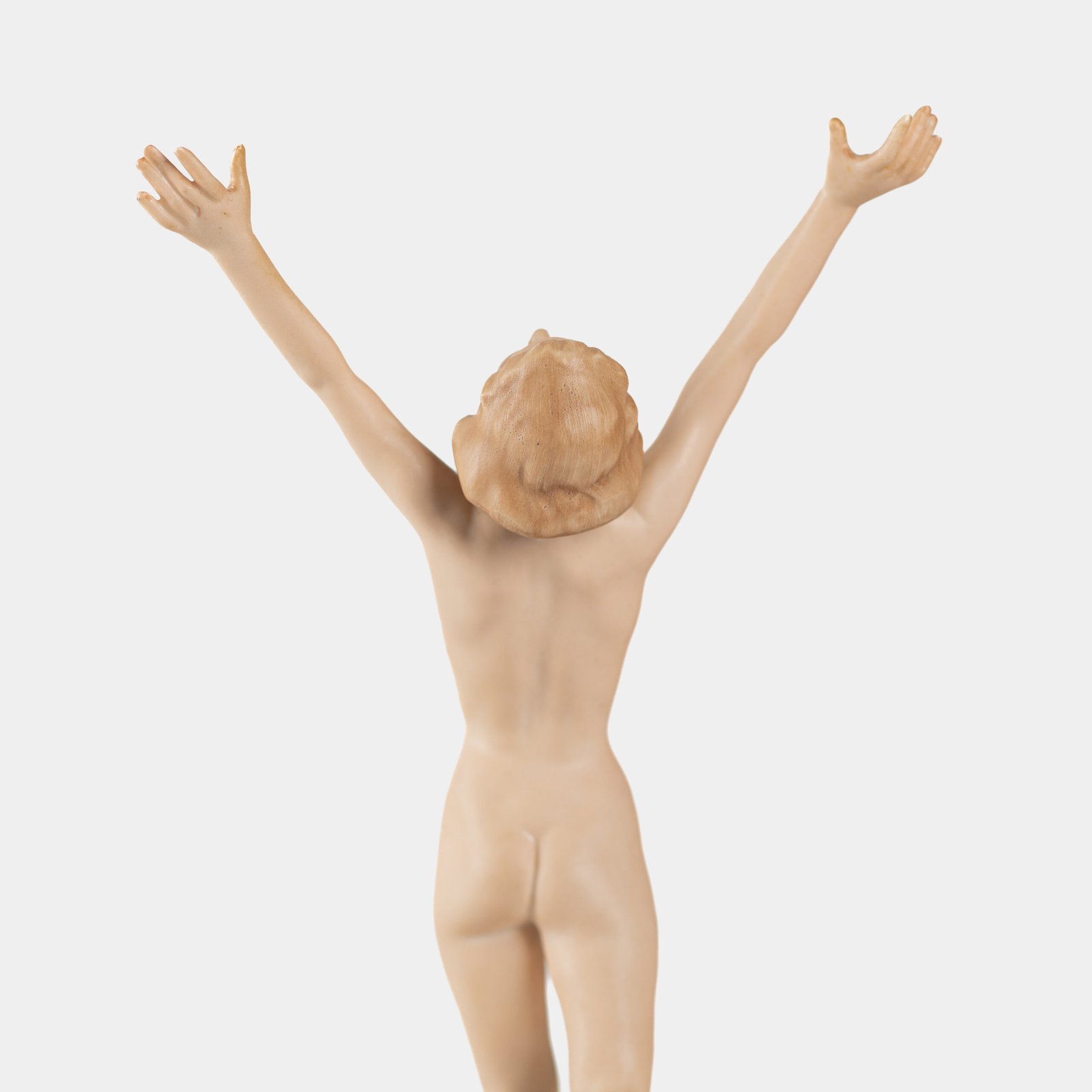 Karl Tutter porcelain figurine “Sonnenkind” – Art Deco sculpture by Hutschenreuther Germany, c.1935–1940 Art Deco porcelain figurine titled “Sonnenkind” (“Sun Child”), modeled by Karl Tutter for Hutschenreuther ca. 1935–1940. Depicts a nude young woman balancing on a golden sphere, arms extended in a dynamic pose. White porcelain with a matte pinkish flesh-tone finish, painted facial features, and satin brown hair. Gilded accents on the sphere and base. Rare signed version with circular base and gold trim.