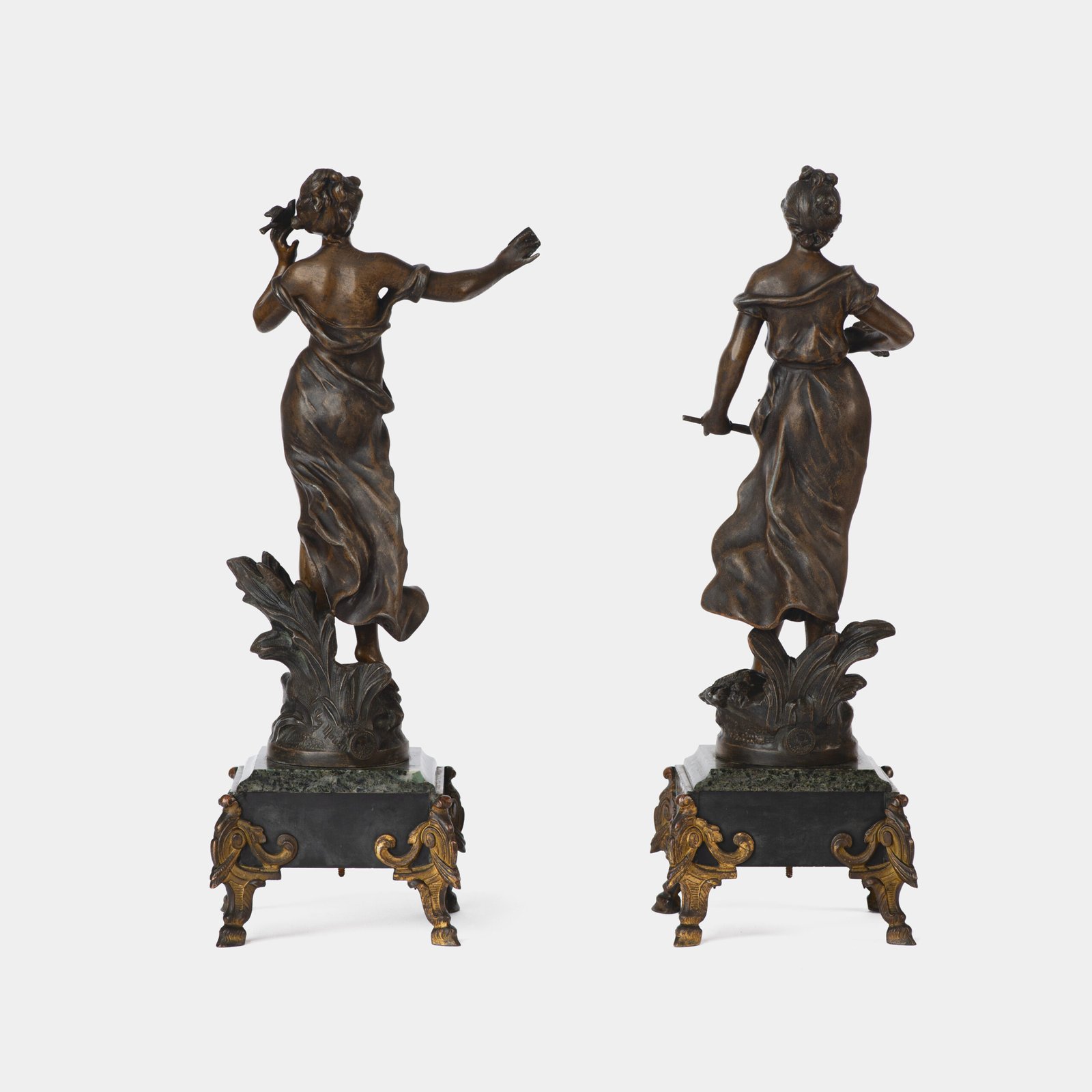 "Pair of Art Nouveau sculptures by Auguste Moreau, La Moisson and Le Message, in zinc with a bronze patina on a marble base, circa 1880-1900."