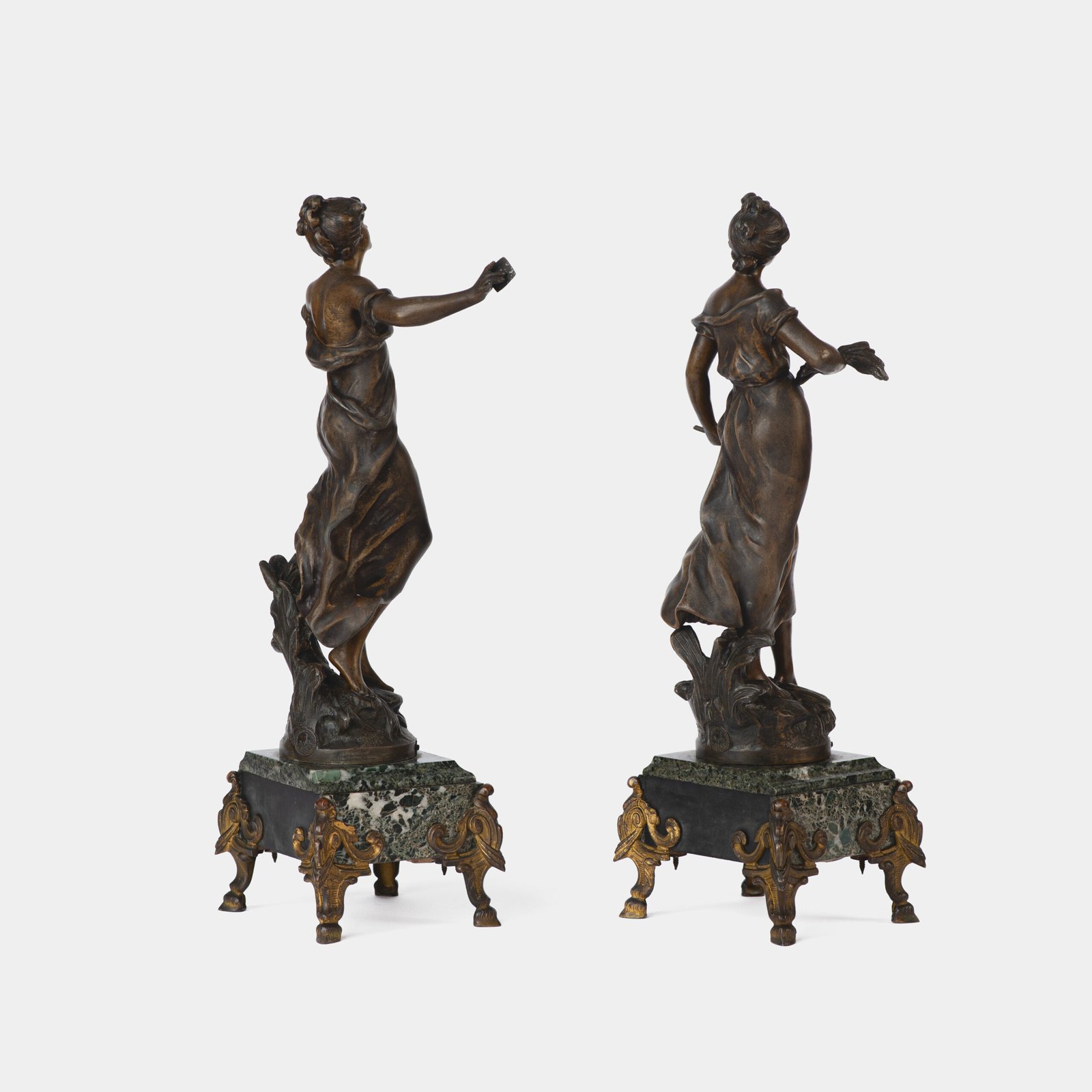 "Pair of Art Nouveau sculptures by Auguste Moreau, La Moisson and Le Message, in zinc with a bronze patina on a marble base, circa 1880-1900."
