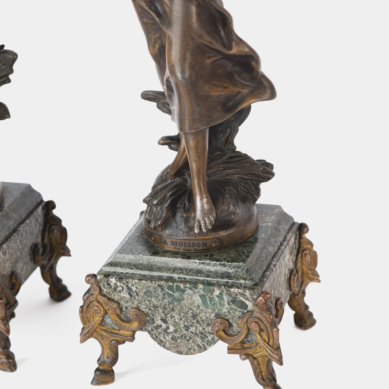 "Pair of Art Nouveau sculptures by Auguste Moreau, La Moisson and Le Message, in zinc with a bronze patina on a marble base, circa 1880-1900."