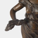 "Pair of Art Nouveau sculptures by Auguste Moreau, La Moisson and Le Message, in zinc with a bronze patina on a marble base, circa 1880-1900."