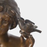 "Pair of Art Nouveau sculptures by Auguste Moreau, La Moisson and Le Message, in zinc with a bronze patina on a marble base, circa 1880-1900."
