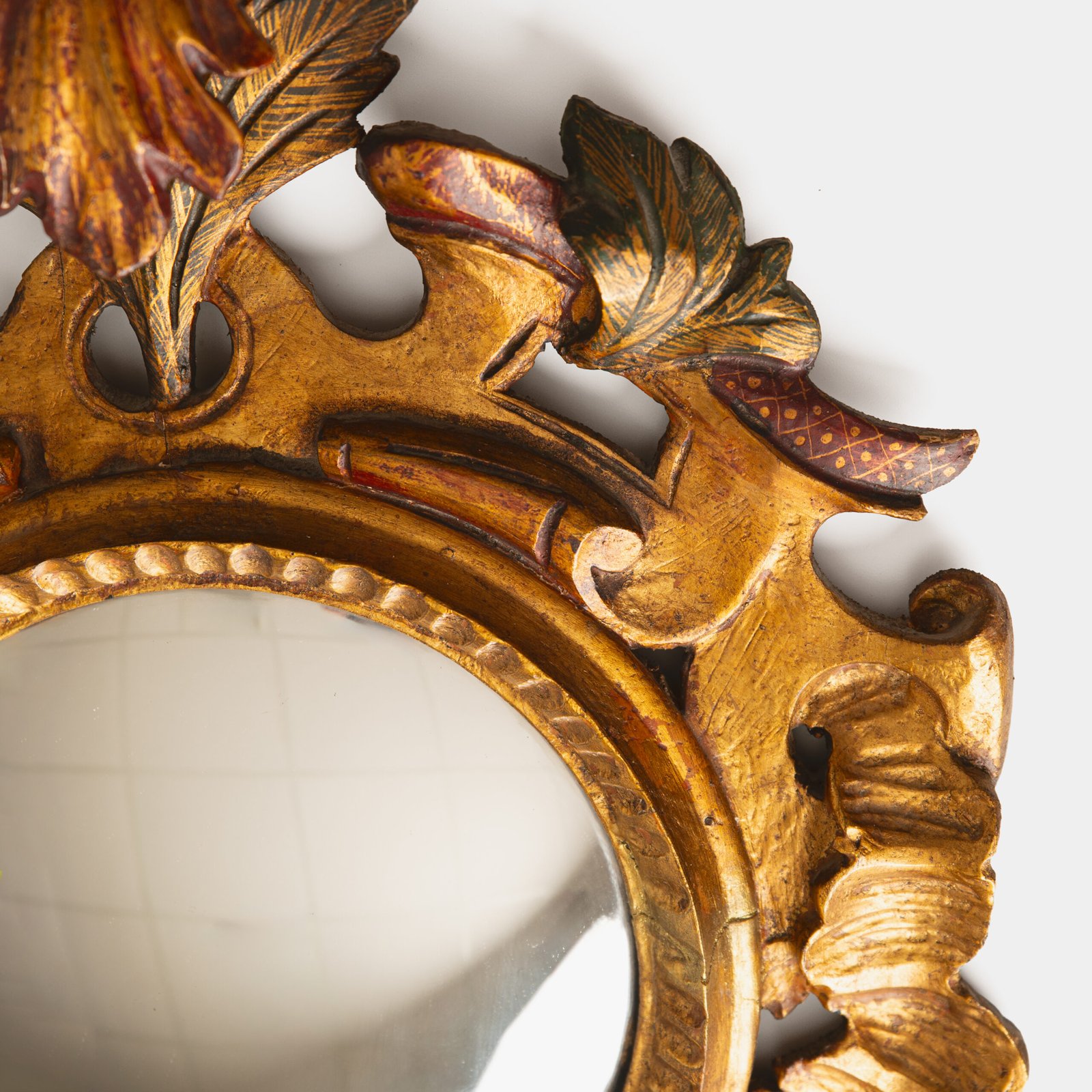 French convex mirror with gilt carved frame and original convex glass (c.1880–1920)