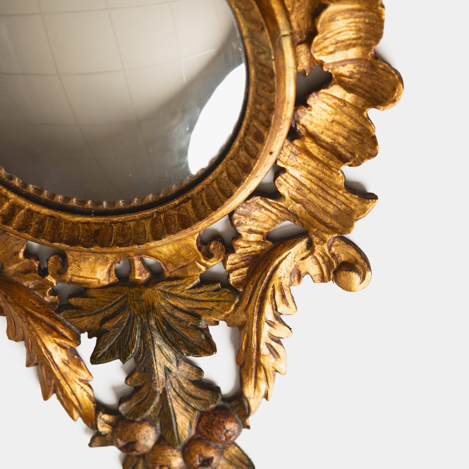 French convex mirror with gilt carved frame and original convex glass (c.1880–1920)