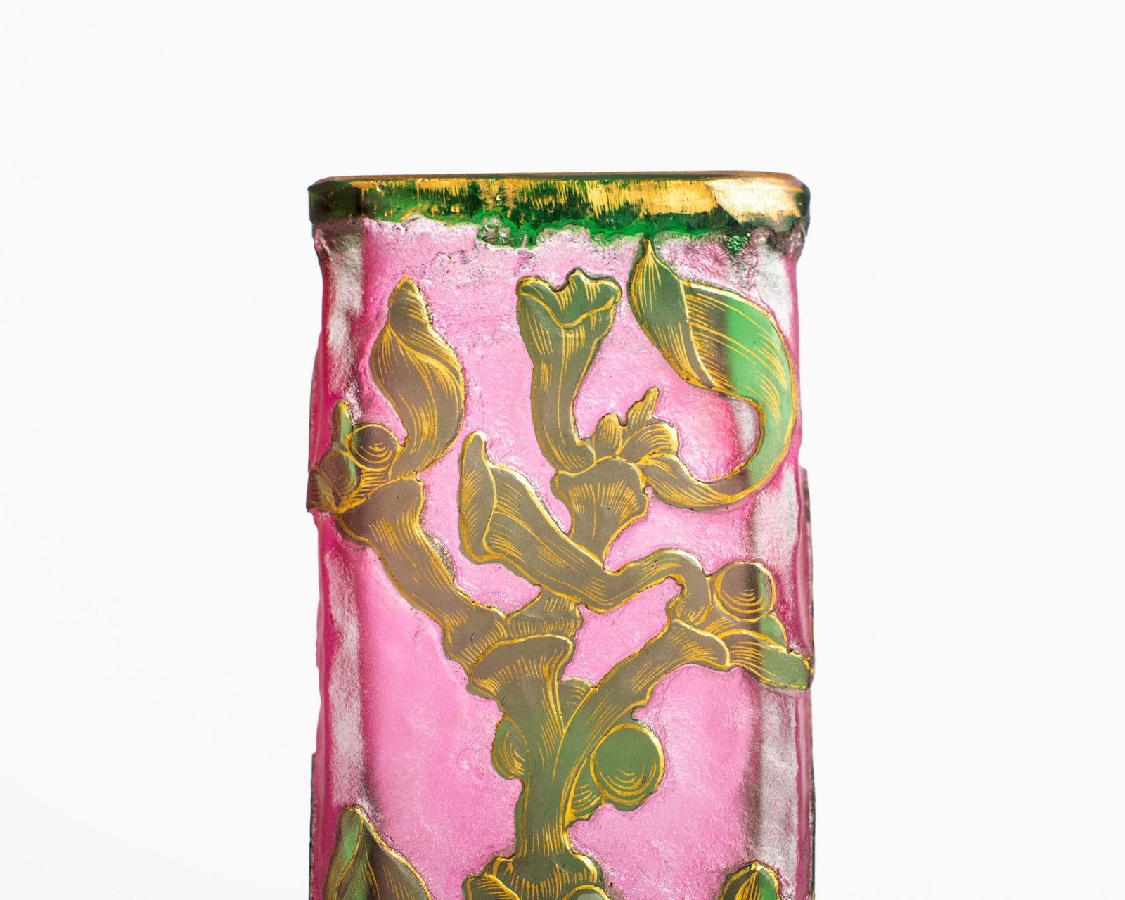 Daum (Nancy) Art Nouveau vase in pink acid-etched (frosted) glass with painted green floral decoration and gold enamel details; signed in gold with the Cross of Lorraine. Dimensions: 4.52 in (11.5 cm) high × 2.16 in (5.5 cm) wide × 2.16 in (5.5 cm) deep. Excellent condition, no chips; representative example of French art-glass production, c. 1900–1920, suitable for collections and interior design projects.