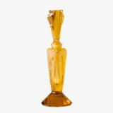 Large German Art Deco perfume bottle in satin-finished pressed amber glass, c. 1930, with figurative relief panels of nude female figures in different poses, faceted geometric base and tall fan-shaped stopper; height 29 cm / 11.42 in, width 9.5 cm / 3.74 in.
