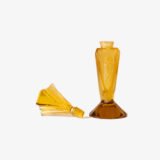 Large German Art Deco perfume bottle in satin-finished pressed amber glass, c. 1930, with figurative relief panels of nude female figures in different poses, faceted geometric base and tall fan-shaped stopper; height 29 cm / 11.42 in, width 9.5 cm / 3.74 in.