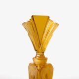 Large German Art Deco perfume bottle in satin-finished pressed amber glass, c. 1930, with figurative relief panels of nude female figures in different poses, faceted geometric base and tall fan-shaped stopper; height 29 cm / 11.42 in, width 9.5 cm / 3.74 in.