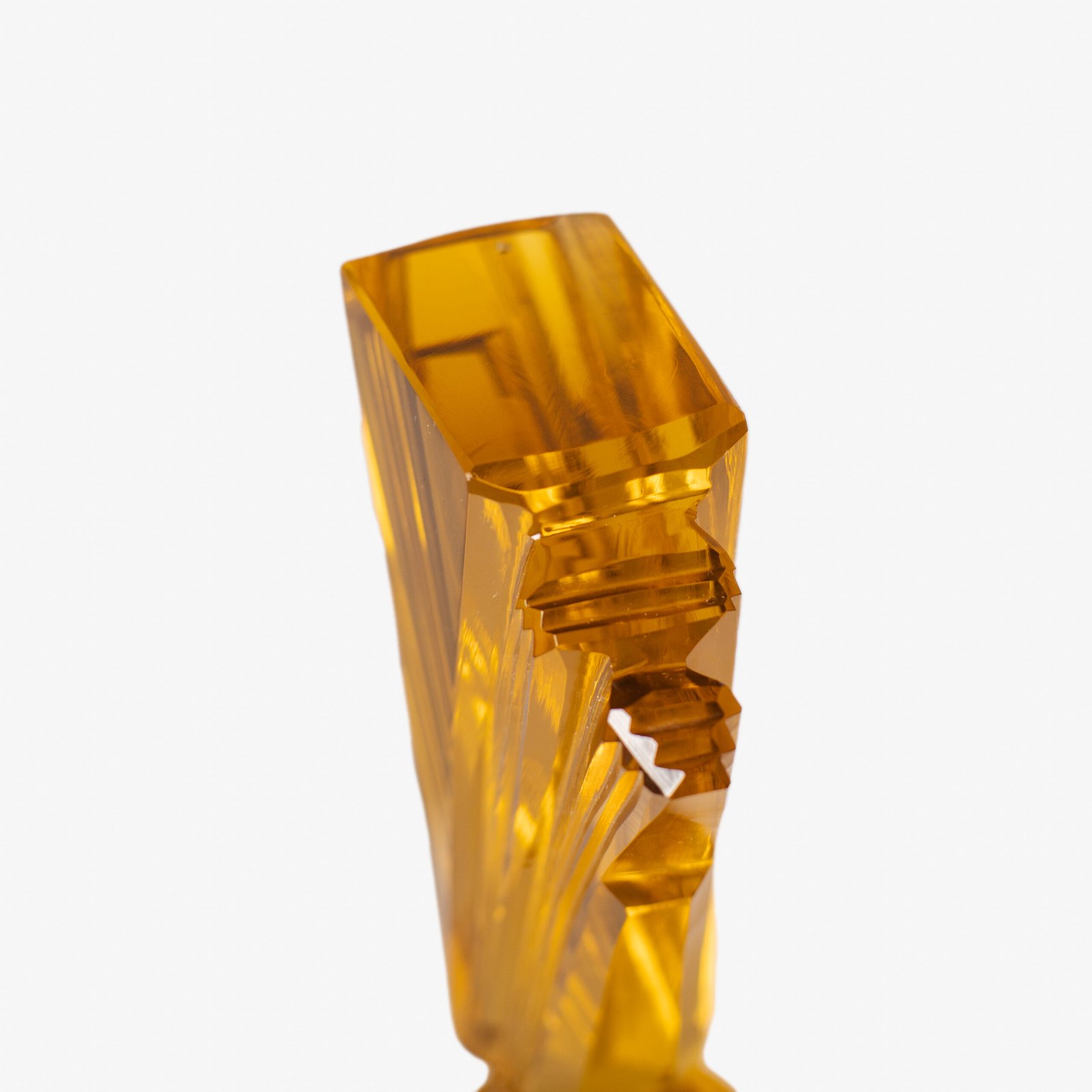 Large German Art Deco perfume bottle in satin-finished pressed amber glass, c. 1930, with figurative relief panels of nude female figures in different poses, faceted geometric base and tall fan-shaped stopper; height 29 cm / 11.42 in, width 9.5 cm / 3.74 in.