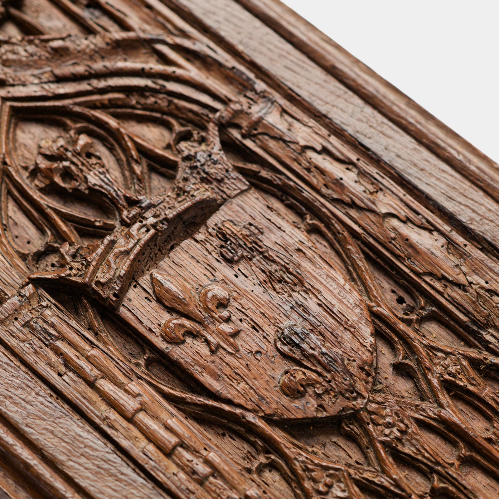 Historic Gothic oak relief with crowned fleur-de-lis arms of Anne de Bretagne, Flamboyant carving c.1495–1510, original patina.