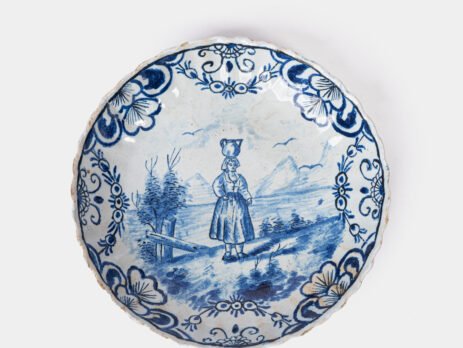 Rare 17th-century Delft blue plate by Adriaen Kocks, ca. 1686–1700, cabinet plate with finely painted rural female figure, signed AK.