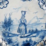 Rare 17th-century Delft blue plate by Adriaen Kocks, ca. 1686–1700, cabinet plate with finely painted rural female figure, signed AK.