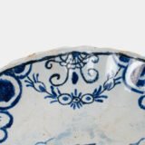 Rare 17th-century Delft blue plate by Adriaen Kocks, ca. 1686–1700, cabinet plate with finely painted rural female figure, signed AK.